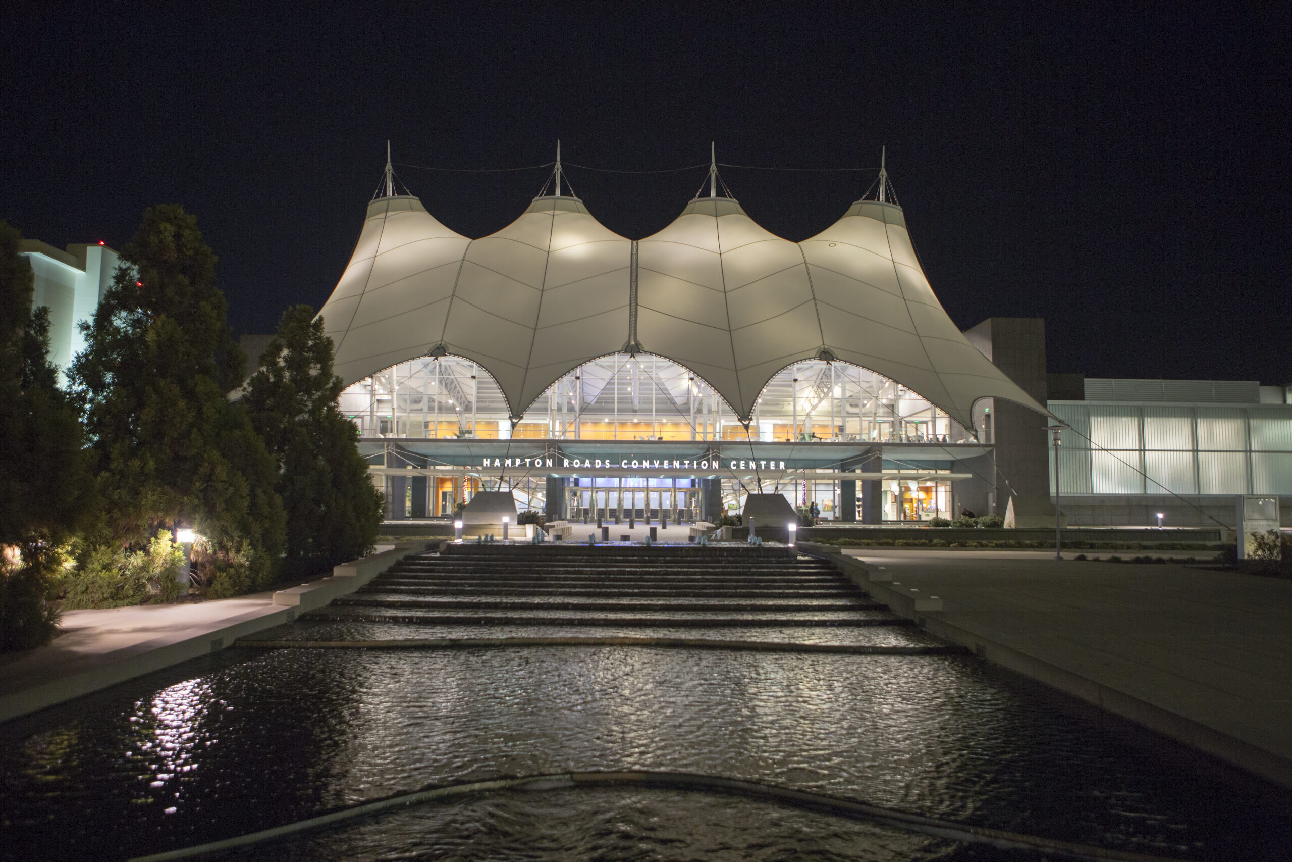 Hampton Roads COnvention Center at night with fountain running from it